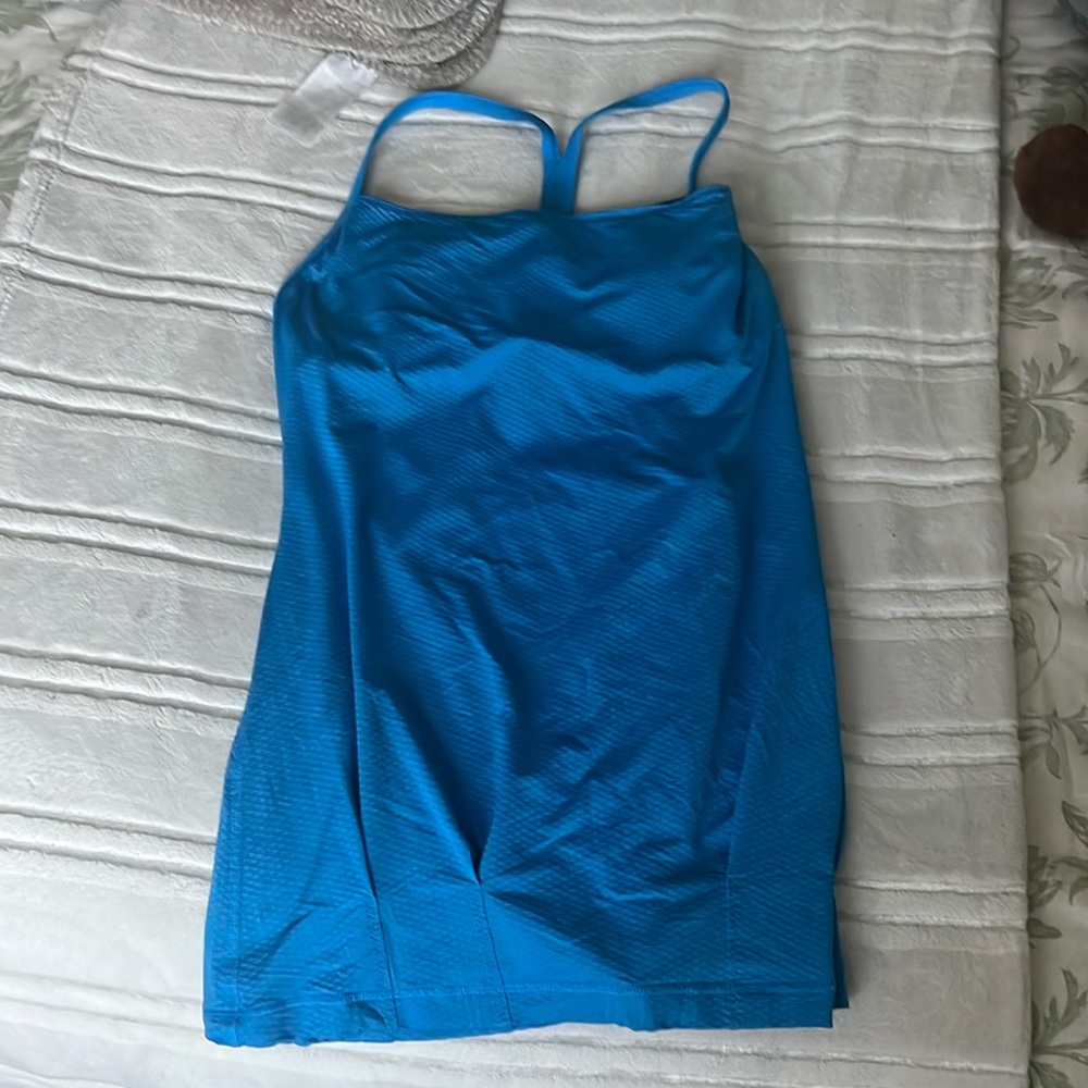 selling lululemon top. It has a built in bra inside and is nice and flowy